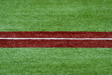 Third base with a white caulk line. Baseball