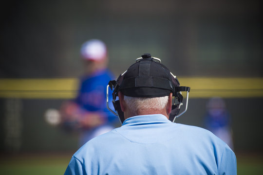 Plate umpire on baseball field, copy space