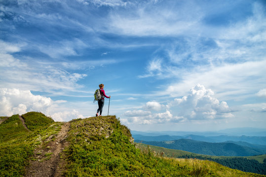 Young woman hiking in the mountains