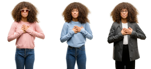 African american young woman wearing different outfits smiling with hands on chest with closed eyes and grateful gesture on face. Health concept.
