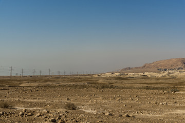 High voltage line towers on the Judean desert