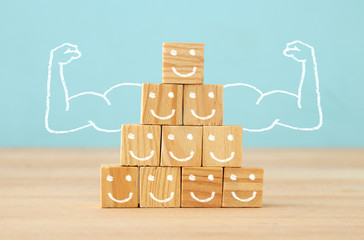 image of wooden blocks with people icons over table ,building a strong team, human resources and...
