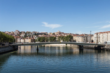 Fototapeta na wymiar Modern bridge over the Rhone river in the heart of Lyon in France second largest city on a sunny summer day