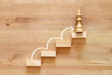 concept image of climbing to the top, progress and winning.