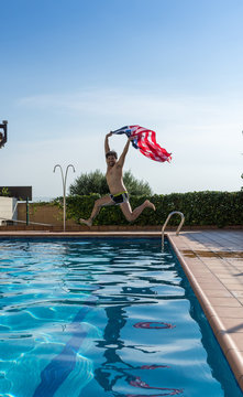 Man on vacation jumping to the pool with United states flag