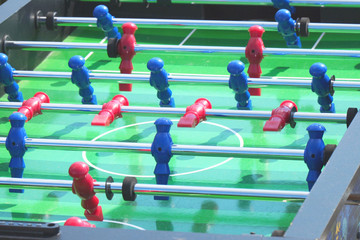 People play kicker table football soccer