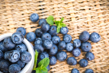 Blueberries. Freshly picked blueberry in ceramic bowl with berries and natural background. Blueberries are known to contain anitoxidant for nutrition health benefits