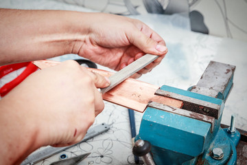 Grinding the copper billet with a file