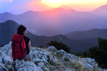 Fototapeta premium hiker contemplating the sunset
