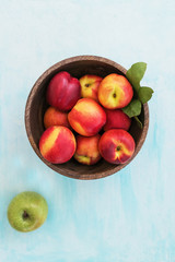 nectarine on light blue background