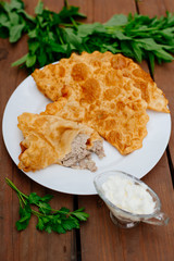 The Caucasian food is a patty made from thin unleavened dough with stuffed lamb and spicy seasonings. Cheburek - fried pie with meat and onions. Traditional dish of many tatar and eastern peoples.