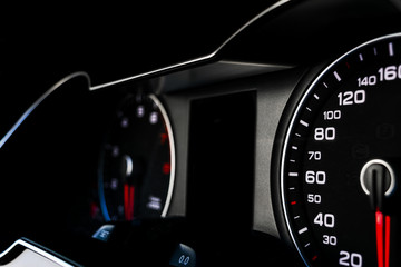 Close up shot of a speedometer in a car. Car dashboard. Dashboard details with indication lamps.Car...