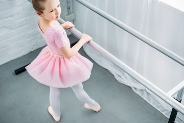 high angle view of graceful little ballerina exercising in ballet school © LIGHTFIELD STUDIOS
