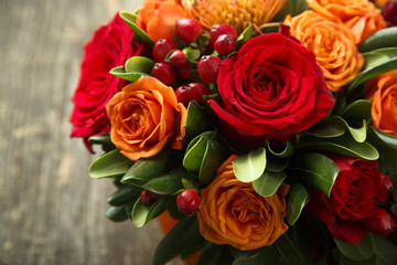 Winter or autumn bouquet with roses
