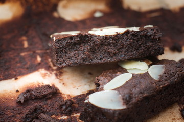 Dark chocolate brownies with almond topping.