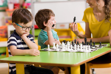 Fototapeta premium Preschool Student and Chess