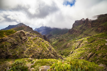 Mountain serpentine. Landscape of the Masca Gorge. Beautiful views of the coast with small villages in Tenerife, Canary Islands
