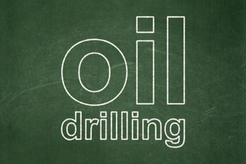 Obraz premium Industry concept: text Oil Drilling on Green chalkboard background
