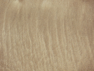 abstract pattern made by tide on sandy beach