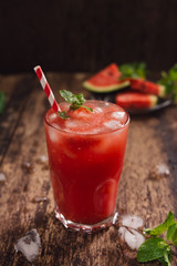 Refreshing summer watermelon juice in glasses with slices of watermelon