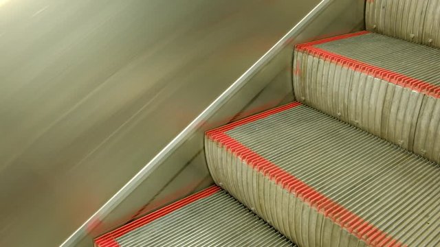 moving escalator down, mecanic, electic, Stair and escalators in a public area. hd footage 4k