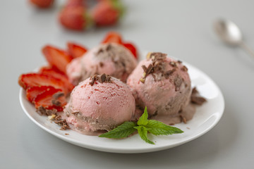 Chocolate and strawberry ice cream, with berries, sprinkled with chocolate