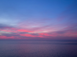 Pink and purple sky above sea