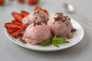 Chocolate and strawberry ice cream, with berries, sprinkled with chocolate