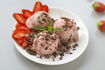Chocolate and strawberry ice cream, with berries, sprinkled with chocolate