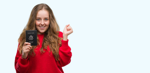 Naklejka premium Young blonde woman holding passport of United States of America screaming proud and celebrating victory and success very excited, cheering emotion