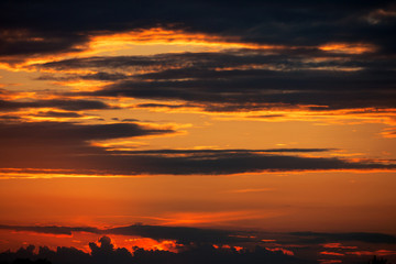 Dramatic sky with storm clouds in sunset time. Mulicolored background