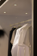 white and black clothes in the wardrobe