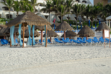 Relaxing chairs at beach for sun bath. Blue, travel