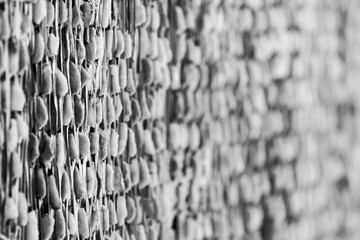 Textured background of wall with wooden an stones