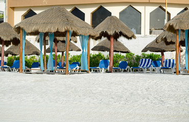 Relaxing chairs at beach for sun bath. Blue, travel