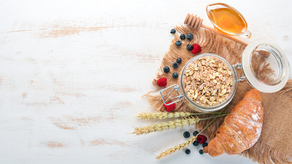 Dry oatmeal porridge in a plate. Breakfast. On a wooden background. Top view. Free space for text.