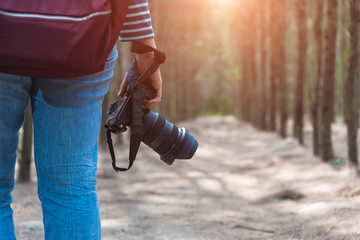 Young woman lifestyle using DSLR camera photographer travel taking photo