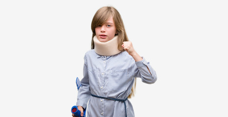 Young blonde child injured wearing neck collar and crutches annoyed and frustrated shouting with anger, crazy and yelling with raised hand, anger concept