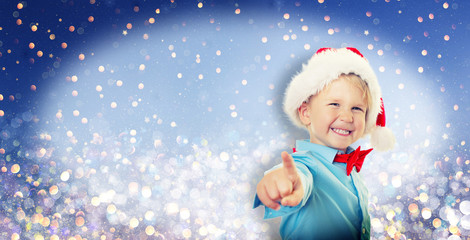 child with christmas cape