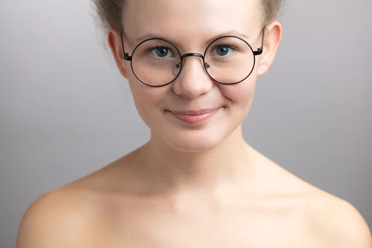 Emulate easy to handle Annotate modest nude girl in round glasses on the isolated white background. close  up photo Stock Photo | Adobe Stock