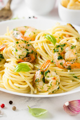 Italian pasta, spaghetti with shrimp, herbs, garlic and cheese. Tasty healthy food
