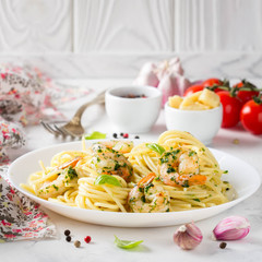 Italian pasta, spaghetti with shrimp, herbs, garlic and cheese. Tasty healthy food