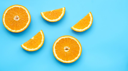 Oranges fruit on a blue background.