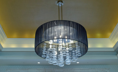 Chandelier hanging from ceiling. Decorative, background