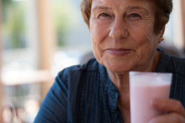 senior drinks milk shake