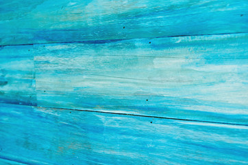 Abstract pattern painted by blue color on wooden plank