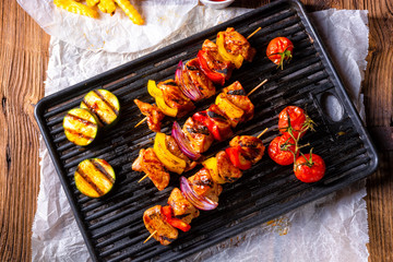 Rustic shish kebab skewers with marinated ham meat paprika and red onion