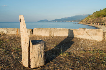 homemade chair made of wood. a wooden armchair with a view of the mountains and the sea.