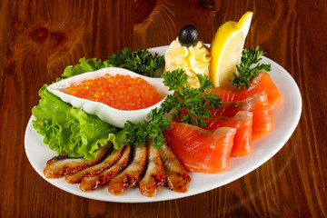 Trout fillet, red caviar and eel