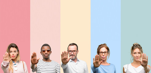 Mixed group of people, women and men annoyed with bad attitude making stop sign with hand, saying...